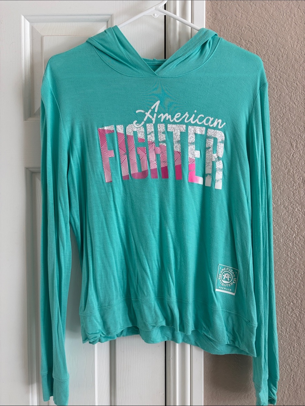 American Fighter Teal Hooded Long-Sleeve Top with Pink & White Logo